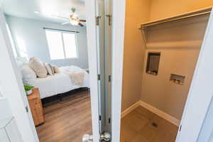 Washroom with hookup for a washing machine and ceiling fan