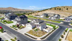 Aerial view of residential area featuring a mountainous background
