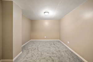 Unfurnished room featuring carpet flooring and baseboards
