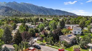 Aerial view of residential area featuring a mountainous background