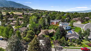 Aerial view of residential area featuring a mountainous background