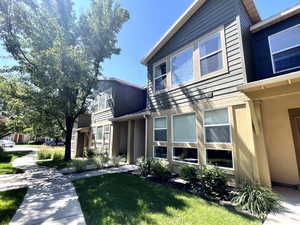 View of property exterior featuring stucco siding and a lawn