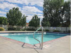Community pool with a patio area