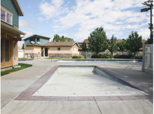 Community pool featuring a patio