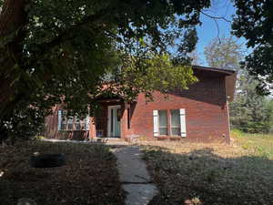 View of front of property with brick siding