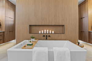 Full bath featuring a bath