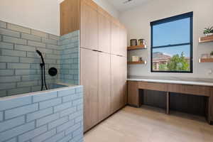 Full bathroom featuring tile patterned flooring and a walk in shower