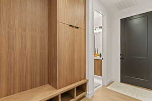 Mudroom featuring light wood-type flooring
