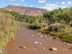 View of mountain backdrop featuring a large body of water