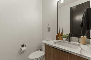 Bathroom with vanity and toilet
