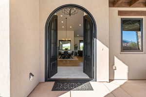 Property entrance featuring stucco siding