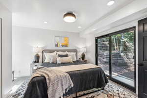 Carpeted bedroom with access to exterior and recessed lighting