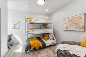 Bedroom featuring wood finished floors and recessed lighting