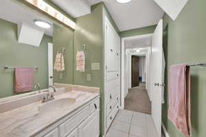 Bathroom featuring vanity and tile patterned flooring