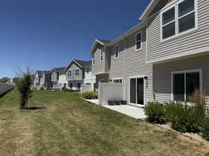 View of yard with a residential view and a patio area