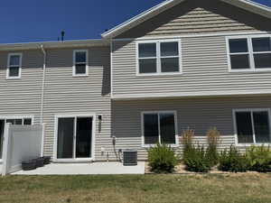 Back of property featuring a patio area