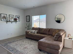 Living room with wood finished floors and baseboards