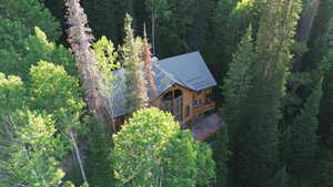 View from above of property with a forest