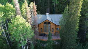 View of subject property featuring a forest