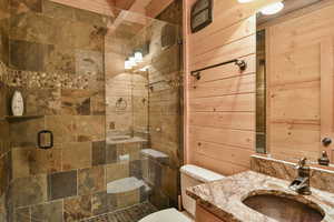 Bathroom with vanity and a stall shower