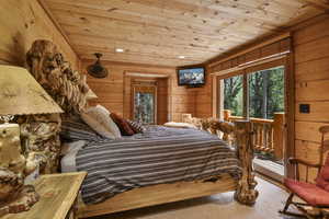 Bedroom featuring wood ceiling, wooden walls, recessed lighting, and carpet flooring