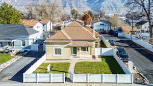 Aerial perspective of suburban area with a mountain backdrop