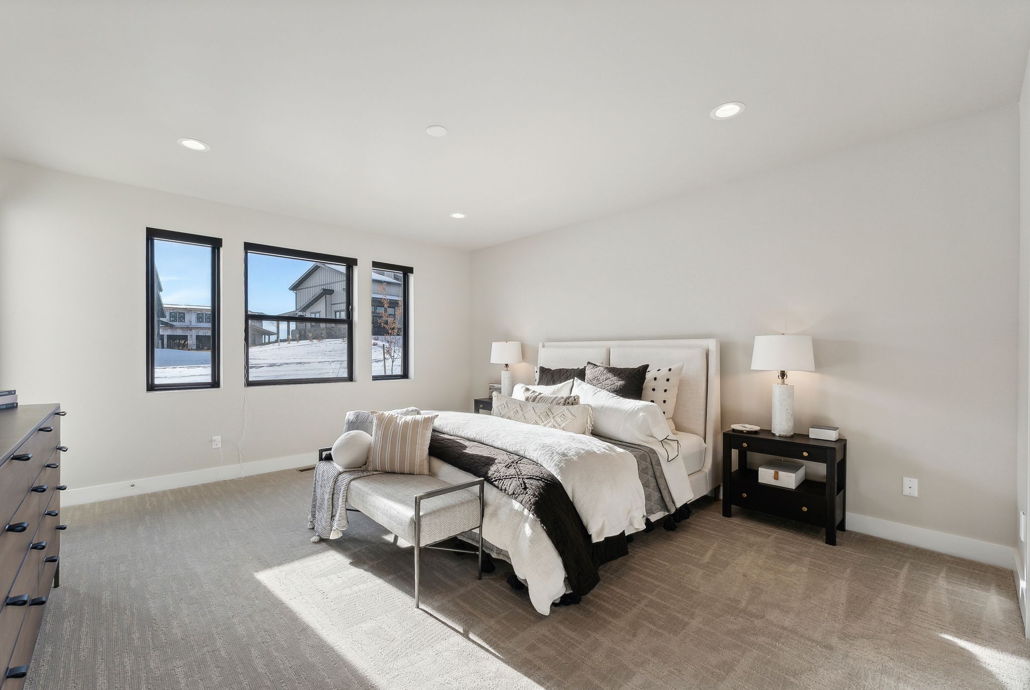 Carpeted bedroom with baseboards and recessed lighting