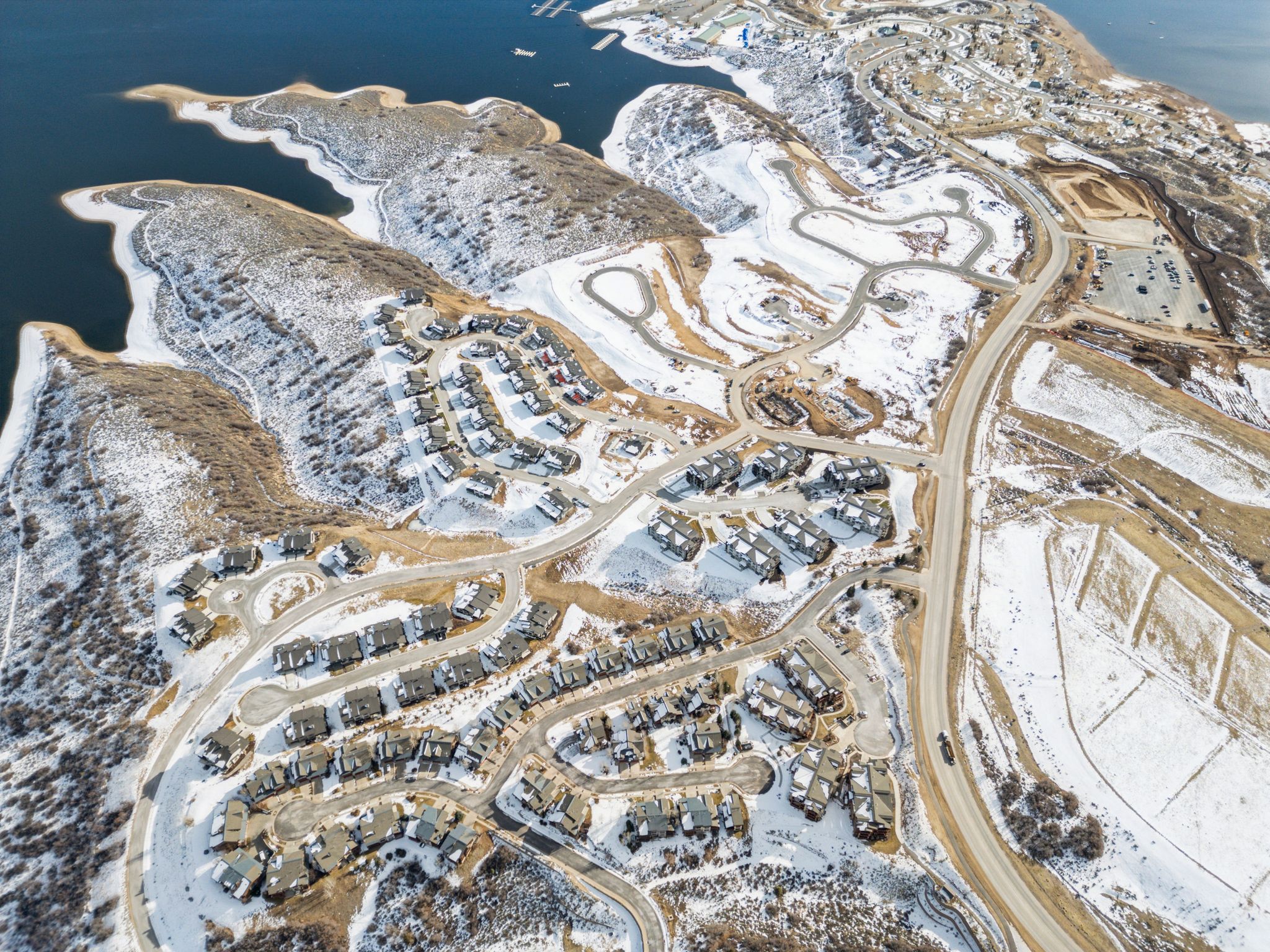 Aerial view of property's location with a nearby body of water