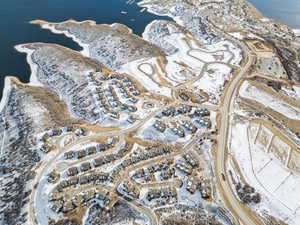 Aerial view of property's location with a nearby body of water