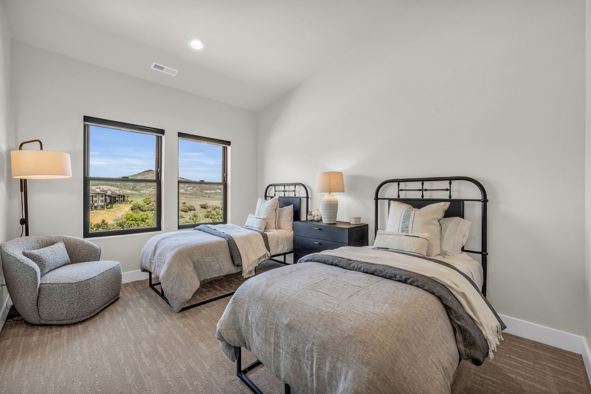 Bedroom with lofted ceiling, wood finished floors, and recessed lighting