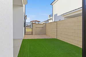 View of yard with a gate