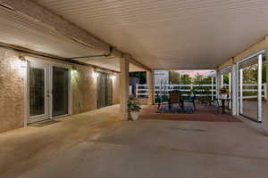 Patio terrace at dusk featuring a patio and outdoor dining area