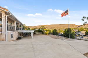 View of patio featuring a mountain view and a detached carport