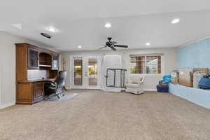 Carpeted office space featuring recessed lighting, plenty of natural light, french doors, and a ceiling fan
