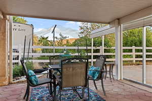 Sunroom featuring outdoor dining space