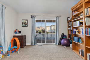 Game room with carpet flooring and baseboards