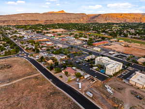 Aerial view of property and surrounding area featuring mountains