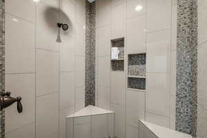 Bathroom with tiled shower
