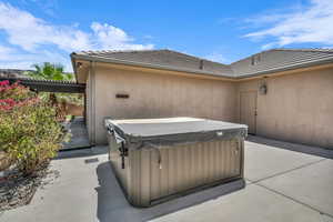View of patio / terrace with a hot tub