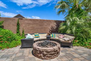 View of patio / terrace with an outdoor living space with a fire pit