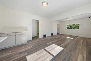 Empty room featuring wood finished floors and baseboards