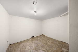 Spare room featuring a textured ceiling