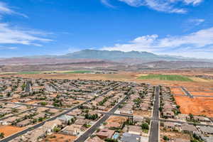 Aerial perspective of suburban area featuring a mountain backdrop