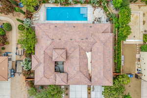 View of subject property with a pool