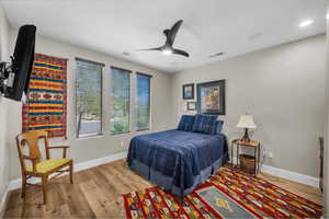 Bedroom featuring light wood-style flooring and ceiling fan