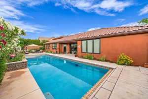 Outdoor pool featuring a patio area