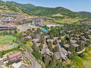 Aerial view of property's location with a mountain backdrop