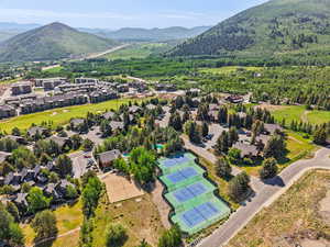 Bird's eye view of a mountainous background and a heavily wooded area