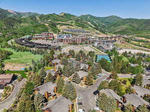 Aerial view of property's location featuring mountains