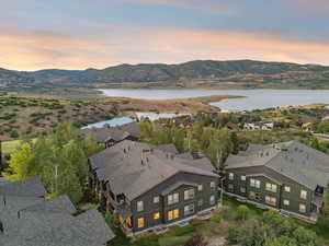 Aerial view at dusk of a water and mountain view and a residential view